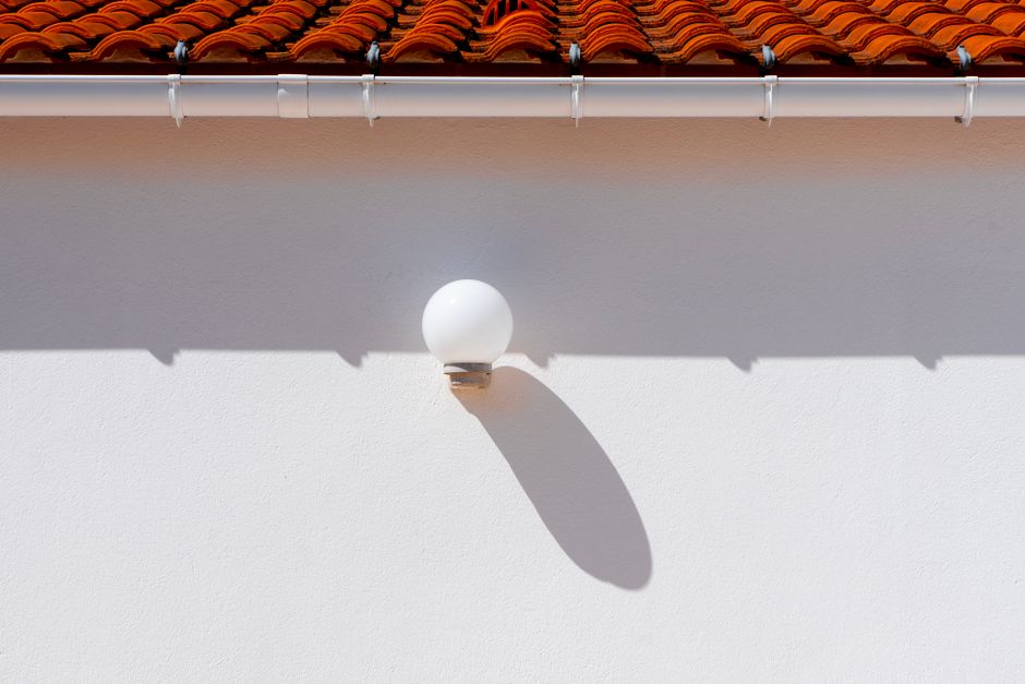 Professional gutter cleaning and maintenance service on residential home